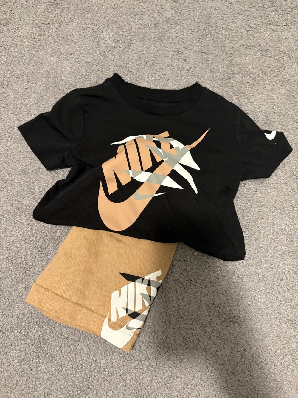 Nike Kids Black Tee with Tan and White Logo Graphic